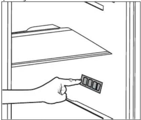 Line drawing of a hand holding a small object near a shelf.
