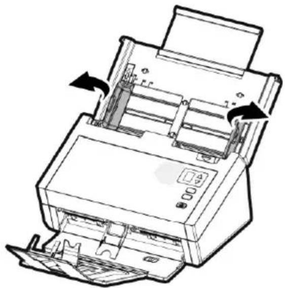 Line drawing of a printer with internal components and directional arrows indicating flow or movement (no text or symbols)