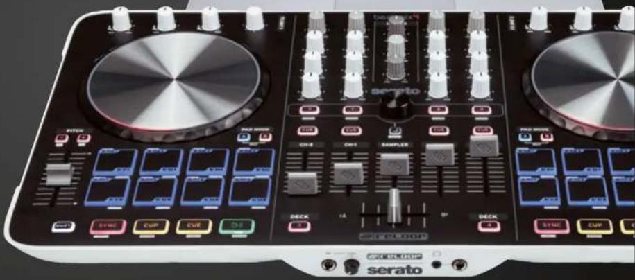 Close-up of a Serato audio synthesizer interface with multiple dials, knobs, and control buttons (no readable text or symbols beyond branding)