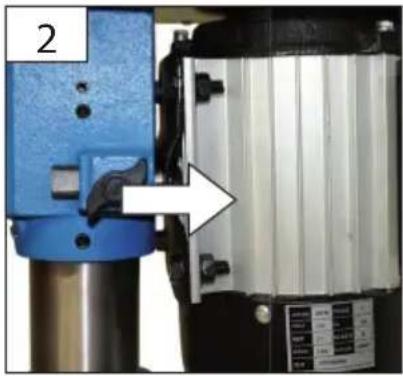 Close-up of a mechanical device with blue and black components, showing a white arrow pointing to a component (no visible text or symbols)