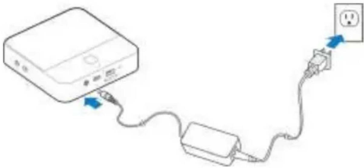 Line drawing of a device connected to a power outlet via cable (no text or symbols)