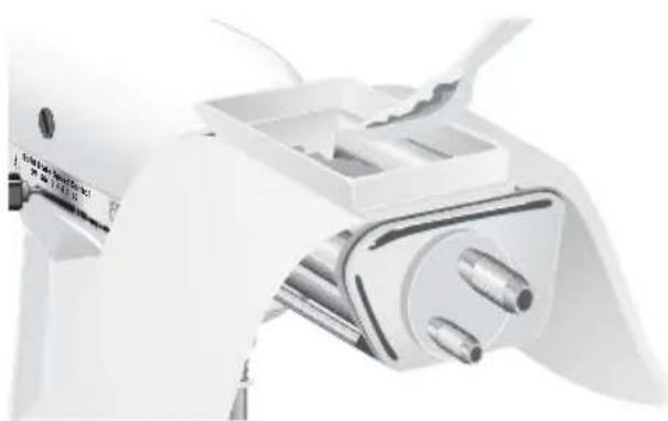 Close-up of a white mechanical device with metallic components and a handle (no visible text or symbols)