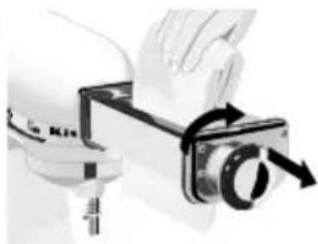 Close-up of a hand holding a small mechanical device with a circular component, no visible text or symbols