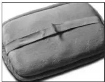 Close-up of a dark, textured object with a small mark on the side (no visible text or symbols)
