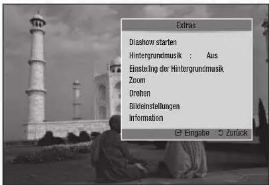Extras Diashow starten Hintergrundmusik : Aus Einstelling der Hintergrundmusik Zoom Drehen Bildeinstellungen Information Eingabe : Zurück