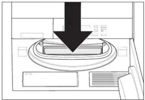 Diagram of a computer monitor with a black downward arrow indicating a download or press operation (no text or symbols present)