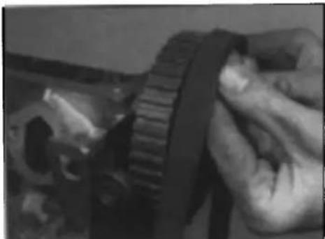 VOLKSWAGEN Polo (1990) - Caution: If the belt is refitted differently, accelerated wear leading to premature failure may occur. - 1