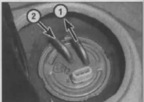 Diagram of a mechanical component with numbered parts and directional arrows indicating motion or flow