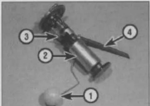 Labeled diagram of a mechanical device with numbered parts and directional arrows indicating components
