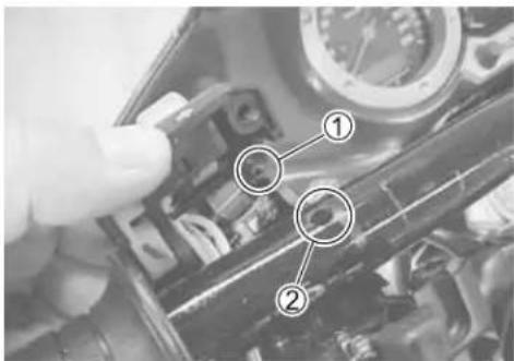Close-up of a mechanical component with numbered annotations pointing to specific parts, likely for assembly or inspection.