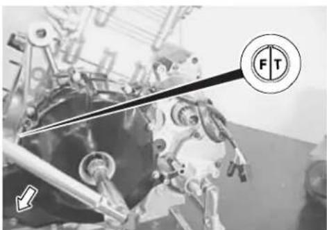 Technical diagram of a mechanical assembly with labeled components and directional arrows indicating motion or force directions.