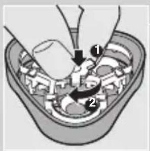 Diagram showing a hand pressing down on a mechanical component with numbered parts and directional arrows indicating motion or force.