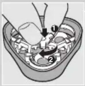 Diagram showing a mechanical assembly with labeled parts, including a tool and directional arrows indicating motion or force.
