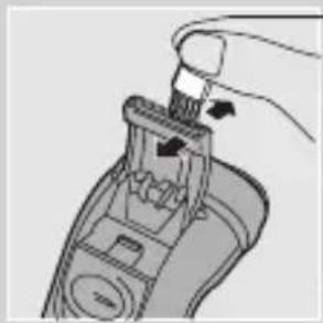 Illustration of a hand using a handheld tool to press or install a device (no text or symbols visible)