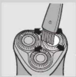 Diagram of a mechanical device with three circular components and a tool inserted, showing rotational motion (no text or symbols)