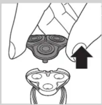 Illustration of a hand holding a circular object with concentric rings, next to a separate view of a device with three circular features (no text or symbols)