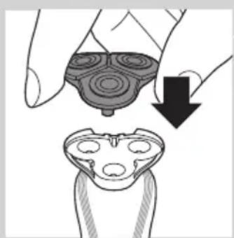 Illustration of a hand holding a circular object with concentric rings, and a magnified view of a device with internal components (no text or symbols)