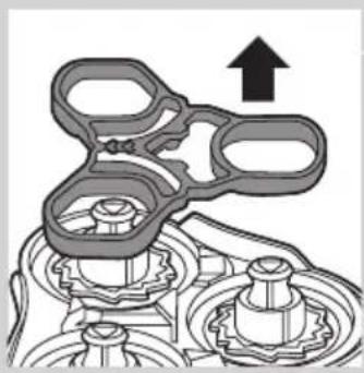 Mechanical gear assembly diagram showing interlocking gears and a directional arrow (no text or labels)
