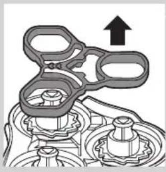 Mechanical assembly diagram showing gears and shafts with an upward arrow (no text or symbols)