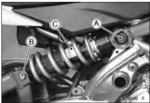 Mechanical assembly diagram with labeled components A, B, and C for automotive suspension system