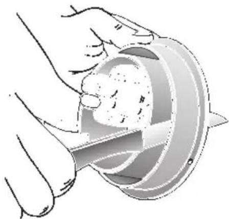 Illustration of hands using a tool to cut a circular object with a textured surface (no text or symbols)