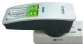 Close-up of a white electronic device with a green indicator light and control panel (no visible text or symbols)