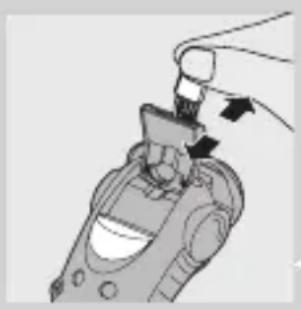 Illustration of a hand inserting a component into a device (no text or symbols visible)