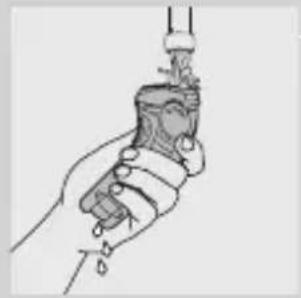 Line drawing of a hand holding a tool or device with a handle and lever (no text or symbols)