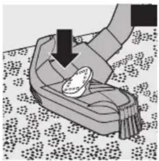 Illustration of a hand pressing down on a small object with a downward arrow, placed on a patterned surface (no text or symbols)