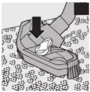 Illustration of a hand holding a small object over a textured surface, with no visible text or symbols.