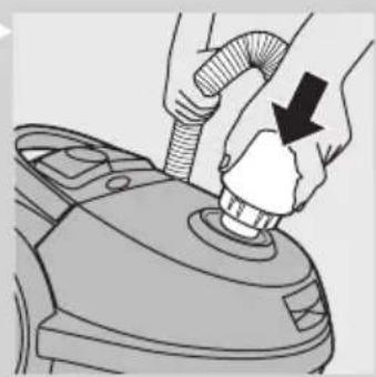 Illustration of hands using a hairdryer to press down a component (no text or symbols visible).