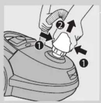 Diagram showing a hand using a tool to press or adjust a component, labeled with numbered parts and directional arrows.