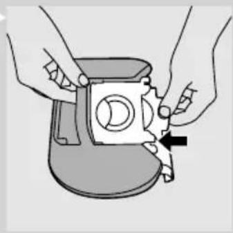 Illustration of hands assembling a mechanical component with a circular component and a black arrow indicating direction (no text or symbols)