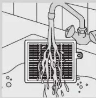 Illustration of a showerhead spraying water into a grid-patterned air vent (no text or symbols).