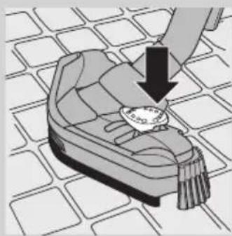 Illustration of a hand placing a small object on a patterned surface, with no visible text or symbols.