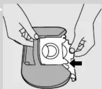 Illustration of hands assembling a mechanical component with a black arrow indicating assembly (no text or symbols present)