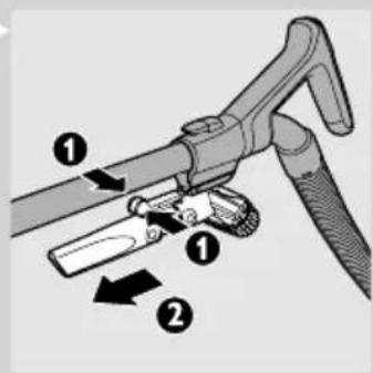 Diagram of a manual tool with labeled parts, showing mechanical assembly and directional arrows.