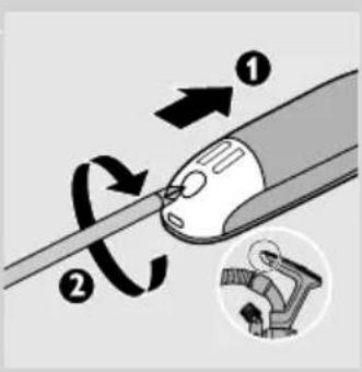 Diagram illustrating a mechanical or electrical component with numbered parts and directional arrows, including a magnified inset showing a close-up of the component.