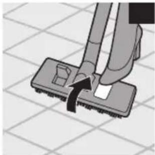 Illustration of a hand using a tool to lift a square object on a tiled floor (no text or symbols)
