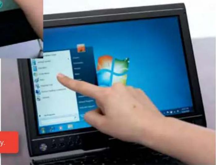 Person pointing at a laptop screen displaying a list of items, with visible icons and text in the background.