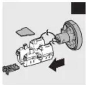 Mechanical assembly diagram showing a motor and gear assembly with directional arrows (no text or labels)