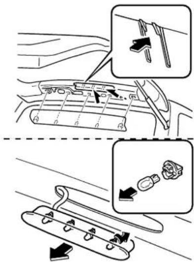 Diagram illustrating car interior components with labeled parts and directional arrows indicating movement or assembly.
