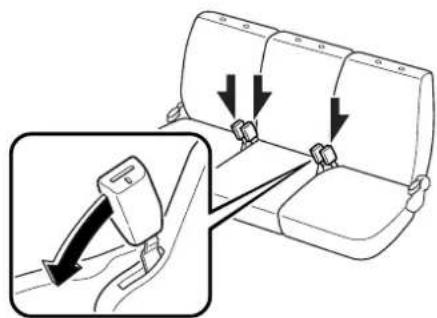 Diagram showing seatbelt buckle adjustment with arrows indicating movement, including a magnified inset of the seatbelt mechanism.