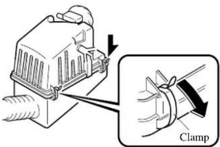 Diagram showing a mechanical device with an inset magnified view labeled 'Clamp' indicating a clamp mechanism.