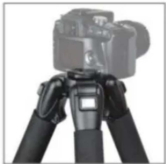 Black-and-white photo of a camera tripod with adjustable arms (no visible text or symbols)