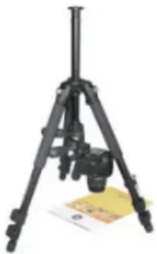 Black tripod-mounted camera mounted on a stand with a yellow paper nearby (no visible text or symbols)