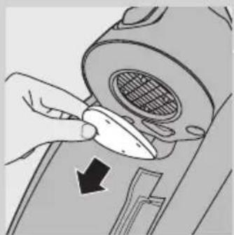 Illustration of a hand using a tool to adjust or install a component, with no visible text or symbols.