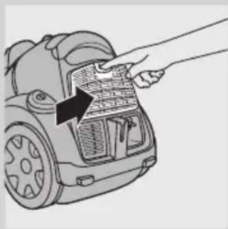 Line drawing of a hand inserting a component into a car's front panel (no text or symbols).