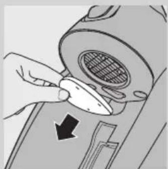 Illustration of a hand using a tool to adjust or install a mechanical component, with no visible text or symbols.