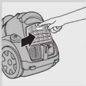Illustration of a hand inserting a component into a car's air vent (no text or symbols).